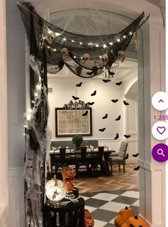 a room decorated for halloween with pumpkins and decorations