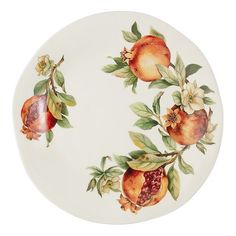 a white plate with fruit painted on the side and green leaves, flowers and branches