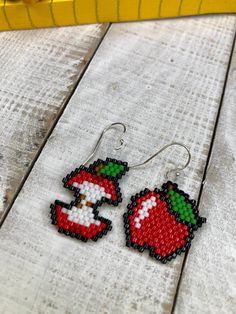 These cute little apple earrings are a perfect teacher appreciation gift! Beaded with miyuki Delica beads and ear wires are made of sterling silver. They measure 4 cm from the drop and 2 cm wide. The earrings were designed by BeadCrumbs on Etsy. Sterling Silver Earrings With Tiny Beads For Gift, Sterling Silver Beaded Earrings As Gift, Colorful Beaded Sterling Silver Earrings For Gift, Colorful Beaded Sterling Silver Earrings As Gift, Sterling Silver Beaded Earrings For Gift, Cute Handmade Adjustable Beaded Earrings, Apple Earrings, Handmade Earrings Beaded, Delica Beads