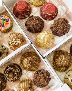 four boxes filled with different types of cookies