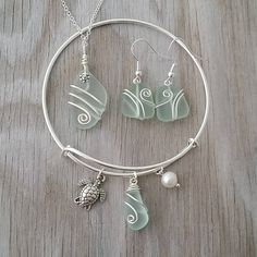 "Aloha! These design shows my love for this beautiful island of Hawaii. This item will be made to order and shipped directly from Hawaii. This is a sea glass necklace with a 20 inch silverchain. The sea glass earrings with a silverhook, Bracelet is silver plated, The diameter is about 70mm and adjustable. This handmade in Hawaii jewelry gift is from cultured sea glass that are specially formed into its shape for jewelry making. Each comes with a gift box with \"handmade by yinahawaii\" stamp and Ocean Earrings, Hawaii Jewelry, Raw Stone Jewelry, Beachy Jewelry, Sea Glass Bracelet, Hawaiian Jewelry, Turtle Charm, Sea Glass Earrings, Sea Glass Necklace