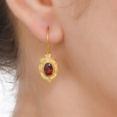 Garnet Vermeil 14K Gold Over Sterling Silver Earring 925 Silver = 3.45 gm. Garnet = 2.20 ct. Garnet is the birthstone for January and is a symbol of friendship. The beautiful earring measures to be 1.00 inches long including the wire and 0.45 inches wide at its maximum points. The earrings have been made by a team of highly trained and skilled artisans. What is Vermeil 14K Gold? It is a thick layer of 14K Gold plating on 925 Sterling Silver. If for any reason you are not completely satisfied, yo Elegant Gold-plated Birthstone Earrings, Elegant Gold Plated Birthstone Earrings, Tarnish Resistant Oval Earrings For Anniversary, Oval Tarnish Resistant Earrings For Anniversary, Gold Oval Birthstone Earrings, Oval Gold Birthstone Earrings, Classic Gemstone Earrings As Gift, Classic Gemstone Earrings Perfect As Gifts, Classic Gemstone Earrings For Gift