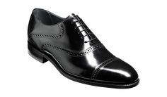 Wilton is a toe cap Oxford with punched quarter detail. An excellently refined shoe for business and formal attire. Designed and made in Northampton, England Premium craftsmanship since 1880 Goodyear Welted construction Full leather insole and lining Calf leather with hi-shine finish Hand-stitched detailing Single leather sole Free USA shipping Black Oxford Shoes, Leather Sole Shoes, Oxford Brogues, Black Oxfords, Oxford Shoes Men, Black Polish, Leather Oxford Shoes, Formal Shoes For Men, Goodyear Welt