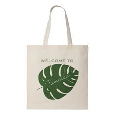 a tote bag that says welcome to jamaica with a large green leaf on it