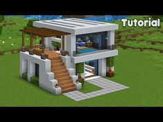 a small modern house built in minecraft with stairs to the second floor and pool