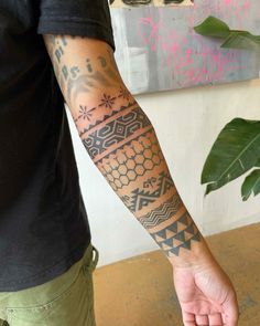 a man with a tattoo on his arm