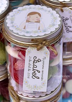 jars filled with candies and candy on top of a table