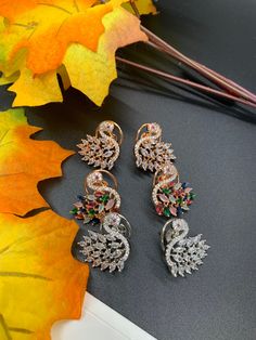 🦚Beautiful Peacock AD ( American Diamond) Style Studs | Everyday earrings | Special occassion earrings| Gifts for her| Peacock | Multicolor | Silver | Gold ⭐️Made with the Finest & High End Quality.  ⭐️ Material- American Diamond High End Quality 100% Satisfaction Guarantee: Long Lasting Plating, High-Quality Stones. Perfect for any occassion-Western, Indian and Casual day looks.    Colors Available- -Multicolor -Gold -Silver Care: It is advisable that you keep our products away from direct hea Luxury Peacock Design Earrings For Celebration, Elegant Peacock Design Earrings For Party, Party Earrings In Peacock Color, Peacock Design Drop Earrings For Party, Peacock Design Drop Earrings For Celebration, Peacock Design Dangle Earrings For Party, Elegant Peacock Colored Earrings For Wedding, Peacock Colored Earrings For Wedding, Multicolor Peacock Design Earrings As Gift