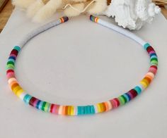 Surfer's Necklace Ideal necklace for the summer !! With its colorful beads of Heishi Recycled Vinyls. This surfer jewel will be ideal for this summer, I can realize it in the colors you want on orders with a realization time to take into account. Surfers jewelry collection Summer jewelry. Heishi beads jewelry Adjustable Rainbow Necklace For Beach, Adjustable Rainbow Necklace For The Beach, Colorful Adjustable Necklace For Beach, Handmade Rainbow Necklace For Beach, Handmade Rainbow Necklace For The Beach, Adjustable Multicolor Strand Necklace, Multicolor Adjustable Strand Necklace, Handmade Rainbow Beaded Necklace For Beach, Necklace Length Chart