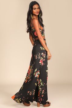 Go ahead, step back and take in the beauty of the Lulus Bloom With a View Black Floral Print Two-Piece Maxi Dress! A moody floral print covers a princess-seamed crop top with a trendy lace-up back. Matching high-waisted, wrapping, maxi skirt completes the set. Fit: This garment fits true to size. Length: Floor length. Size medium Bust: Works best for A to C cup sizes - consider sizing up for fuller bust. Waist: Fitted - very fitted at natural waist. Hip: Not Fitted - room for hips. Undergarments Dress Crop Top, Adhesive Bra, Cup Sizes, Black Floral Print, Step Back, Go Ahead, Wrap Skirt, Red Floral, Gorgeous Dresses