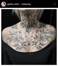 a woman with tattoos on her neck and chest