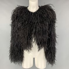 SAN FRANCISCO'S FAVORITE DESIGNER CONSIGNMENT STORES AND ONLINE SHOP GIVENCHY Size 4 Black Silk Feathers Ostrich Cropped Jacket IN-STORE ID: 116572 GIVENCHY cropped jacket comes with a black silk ostrich feather featuring a round neck, a hook & eye fastening, an open front, and a gemstone embellished at neckline. New with Tags. Marked: 38 Measurements: Shoulder: 17 in. Bust: 39 in. Sleeve: 24 in. Length: 20.5 in. Original Retail Price (if known): $4,990.00 Category: Jacket (Outdoor) More Details Ostrich Leather Jacket, Black Formal Outerwear With Feather Trim, Formal Black Outerwear With Feather Trim, Feathered Long Sleeve Evening Outerwear, Long Sleeve Evening Outerwear With Feathers, Evening Long Sleeve Outerwear With Feathers, Black Party Outerwear With Feather Trim, Luxury Outerwear With Feather Trim For Parties, Formal Feathered Outerwear For Winter