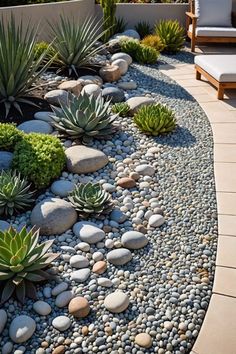 a garden with rocks and plants in it