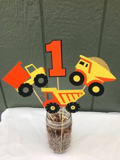 a construction themed centerpiece in a mason jar