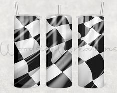 three black and white checkered paper tubes