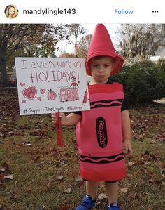 a little boy dressed up as a crayon holding a sign that says i even work on holiday