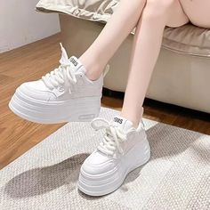 Elevate your style with our Chic White Platform Sneakers for Women. Designed to be both trendy and stylish. these white platform sneakers will add a touch of sophistication to any outfit. Made with high-quality materials. these white platform sneakers provide comfort and support. while the platform sole gives you just the right amount of height. Don't miss out on this must-have footwear for any fashion-forward woman.How to Choose the Right Size:1. Measure your foot length while standing. paralle White Chunky Platform Lace-up Sneakers, White High-top Lace-up Sneakers With Thick Bottom, White High-top Sneakers With Thick Bottom And Lace-up, White Lace-up Wedge Sneakers For Streetwear, White Lace-up High-top Sneakers With Thick Bottom, Thick Sole Round Toe Platform Sneakers For Streetwear, Low-top Thick Bottom Wedge Sneakers For Streetwear, Round Toe Platform Sneakers With Thick Bottom For Streetwear, Low-top Wedge Sneakers For Streetwear With Thick Bottom