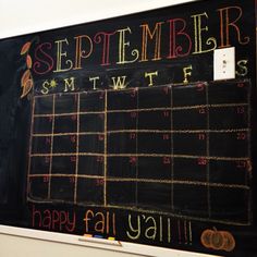 a chalk board with calendars written on it