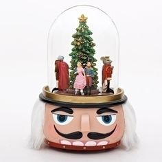 the nutcracker christmas tree is under a glass dome