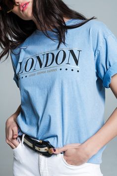 Introducing our Relaxed Fit T-shirt in Washed Baby Blue with London Logo, a vintage-inspired top that effortlessly combines comfort and urban style. This washed baby blue tee features the iconic text "London" on the front, adding a touch of city flair to your casual ensemble.  Made in Italy, this T-shirt boasts quality craftsmanship and a relaxed fit for a laid-back and comfortable feel. The crew neckline and short sleeves enhance the classic and timeless design, making it a versatile piece for everyday wear.  Crafted from 100% cotton, this T-shirt offers breathability and a soft touch against your skin. The model, showcasing the tee in size U and measuring 33-23-35 with a height of 5'11'', beautifully highlights the relaxed fit, providing an easygoing and effortlessly stylish look.  Wheth Trendy Light Blue Text Print Top, Blue Washed T-shirt For Spring, Light Wash Cotton T-shirt With Graphic Print, Light Wash Graphic Print Cotton T-shirt, Light Wash Crew Neck T-shirt With Letter Print, Washed Blue Cotton Top With Letter Print, Trendy Washed Blue T-shirt For Summer, Trendy Light Wash Cotton T-shirt, Trendy Light Wash Short Sleeve T-shirt