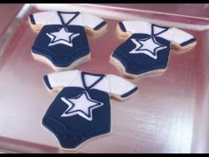 decorated cookies in the shape of baseball uniforms