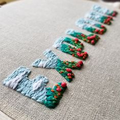 a close up of a piece of fabric on a table cloth with stitching in the middle