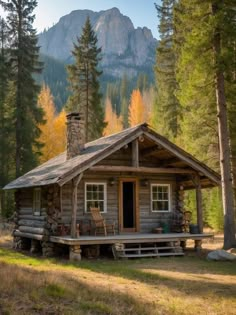 a small log cabin in the woods with mountains in the backgrouds and trees around it