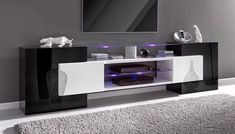 the entertainment center is decorated in black and white with blue lights on it's sides