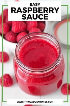 raspberry sauce in a mason jar with fresh raspberries