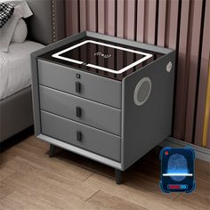 an image of a night stand with a fingerprint on the drawer and a bed in the background