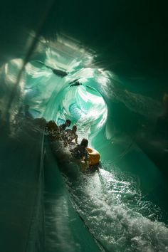 some people are riding on a tube in the water