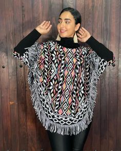 This gorgeous Mexican Artisanal Poncho is perfect for the cold months ahead! The multicolor Fair Isla design adds that perfect pop of color and style to your wardrobe. This poncho is knit, has open sides and it comes in one size so anyone ranging from size Small to 2x will be able to wear it. forrado por dentro, lo que hace ideal para climas muy frios. Casual Oversized Multicolor Poncho, Multicolor Casual Shawl Poncho, Black Bohemian Poncho With Batwing Sleeves, Casual Multicolor Shawl Poncho, Casual Multicolor Shawl Cape, Casual Multicolor Poncho For Winter, Multicolor Long Sleeve Cape For Fall, Winter Long Sleeve Festival Cape, Multicolor Shawl Cape One Size