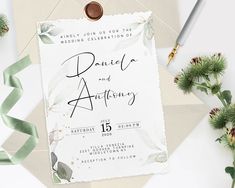 wedding stationery with greenery and calligraphy