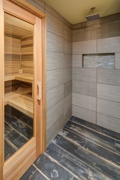 an empty sauna in the corner of a room