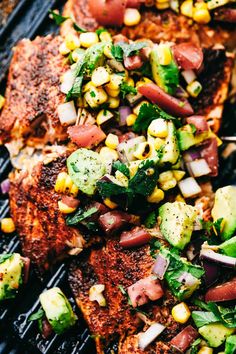 grilled fish with corn, avocado and tomato salsa on the bbq