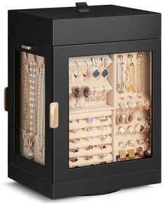 a black jewelry box filled with lots of different types of necklaces