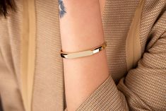 Our geometric bangle bracelet is 14k solid gold. Our gold bangle has an asymmetrical and minimalist style. Zircon stones are located on both sides of the bracelet. This gold-hinged bangle bracelet will accompany you at any time of the day with its minimalist style. It has a safety clasp that you can use every day. You can use this elegant bracelet single or combine it with your other bracelets or bangles like stacking. You can enter the name, initial, date, or whatever you want on the personaliz Baby Cast, Solid Gold Bangle, Minimalist Bangle, Geometric Bangle, Bracelet Stacking, Stacked Bangles, Hinged Bracelet, Elegant Bracelet, Gold Bangle Bracelet