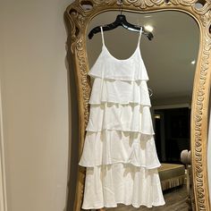 There’s Really Something About A Layered Dress That Just Does It For Us. This Perfectly Simple Dress Has Gorgeous Layers To Add A Bold Fashion Look To The Style! Bonus: The Straps Are Adjustable For An Even More Perfect Fit! White Summer Tiered Dress For Party, Elegant White Sleeveless Tiered Dress, White Tiered Dress For Summer Party, White Summer Party Tiered Dress, White Chic Midi Length Tiered Dress, Chic White Midi Tiered Dress, Chic White Midi Length Tiered Dress, Elegant Sleeveless Tiered Dress For Vacation, Chic White Sleeveless Tiered Dress