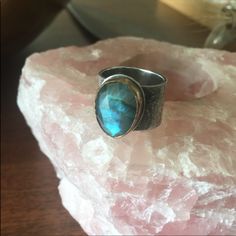 A Stunning Artisan Ring With 14k Yellow Gold Bezel, Sterling Silver Etched Thick Band And A Stunning Labradorite Center Faceted Stone. Size 7. Face Of Stone Is 1/2”. I Don’t See A Stamp. Bohemian Untreated Jewelry For Anniversary, Artisan Untreated Open Ring Jewelry, One-of-a-kind Oval Moonstone Ring In Sterling Silver, Spiritual One-of-a-kind Rings For Anniversary, Artisan Moonstone Anniversary Ring, Artisan Hand Forged Moonstone Ring Gift, Hand Forged Artisan Moonstone Ring Gift, Hand Forged Wide Band Jewelry Gift, Artisan Hand Forged Wide Band Jewelry