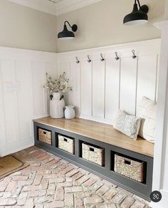 a bench with baskets on it in a room