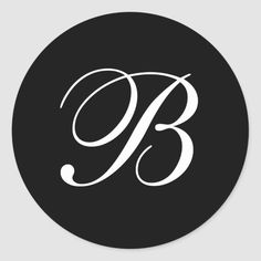 the letter b in black and white on a round sticker