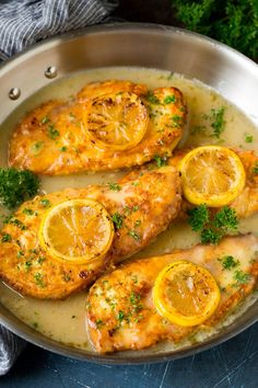 chicken with lemons and parsley in a skillet