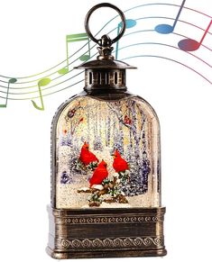 a glass bell jar with two red birds in it and musical notes coming out of the top