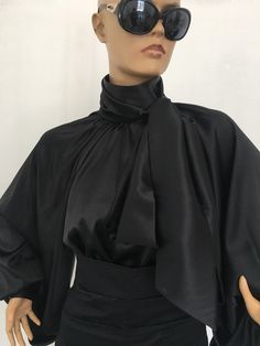 "Amazing and extravagant silk blouse with stand up collar and removable bow tie .Rich puffy sleeves. Elegant and extravagant, perfect for your special occasions. SIZE S - US 6, UK 8, EU 36 bust: bust around 34.5\"/90cm Waist: waist around 27.5\"/70cm Hips: hips around 34.5\"/90cm SIZE M - US 8, UK 10, EU 38 bust: bust around 37.5\"/95cm Waist: waist around 29.5\"/75cm Hips: hips around 37.5\"/95cm SIZE L - US 10, UK 12, EU 40 bust: bust around 39.5\"/100cm Waist: waist around 31.5\"/80cm Hips: h Black Satin Shirt, White Satin Blouse, Black Satin Blouse, Puff Sleeves Blouse, Grunge Jacket, Victorian Collar, Black Silk Blouse, Satin Bluse, Satin Noir