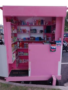 a pink and white food cart with shelves