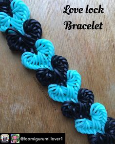 the loom loop bracelet is made with black, blue and turquoise yarns on a wooden table