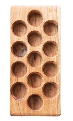 a wooden tray with twelve holes in it