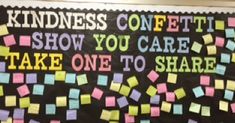 a bulletin board with post - it notes on it that says, kindness confection show you care take one to share