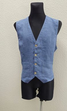 Product details:  Material: 100% Linen  Style: AnSanLinen Sample Colors: Grey blue                                                        DETAILS:       For your convenience, measurements are given in both cm and inches.     Vest size on pictures Size XL: in (cm)    Men's linen fabric vest with one row of buttons, with four buttons, front pockets and elastic waistband at the back. Vests can be worn everyday as modern accessories. A very good addition to the classic suit.    The length of the ves Sleeveless Linen Vest With Pockets, Casual Fitted Nehru Jacket With Pockets, Fitted Nehru Jacket With Pockets For Spring, Fitted Cotton Nehru Jacket With Pockets, Spring Sleeveless Fitted Nehru Jacket, Classic Fitted Sleeveless Denim Vest, Classic Fitted Denim Sleeveless Vest, Waistcoat Men Casual, Linen Vest Mens