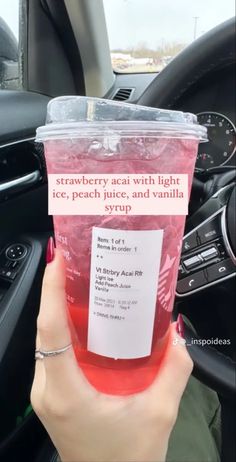 a person is holding up a cup with ice tea in it and the words strawberry sea with light ice, peach juice, and vanilla yogurt